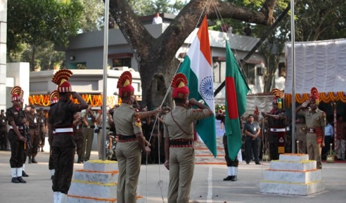 Security forces take part in a parade at the Benapole-Petrapole Border