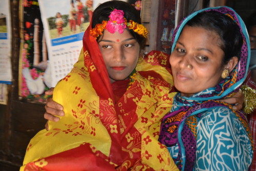 Sonia wearing her yellow benarosi saree on her wedding day.