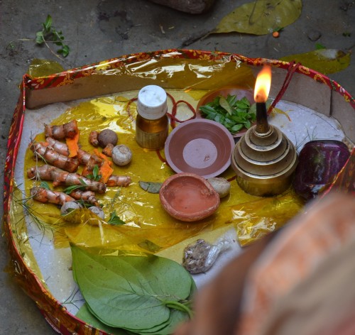 A platter with betel leaf, betel nut and tumeric and at the holud. 