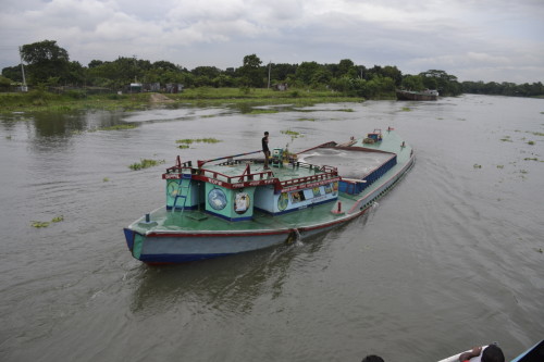 A sand laden vessel destined for filling up the marshy lands in order to create more real estate locations.