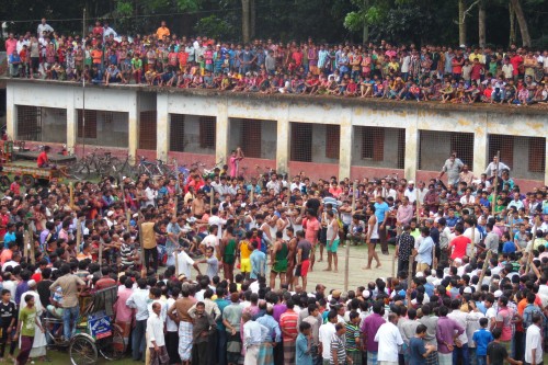 Hundreds of men, women and children all vying to catch a glimpse of the action at the Goshontara village.