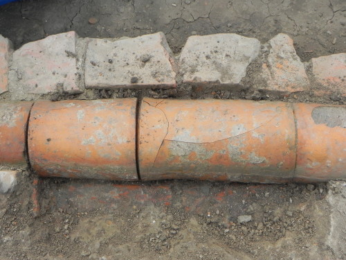 Baked terracotta pipe recovered from the archeological site demonstrating 