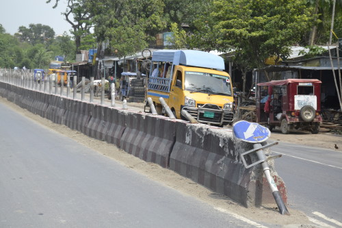 A barrier in the Dhaka-Patura highway, which shows visible signs of accidents at high speed.